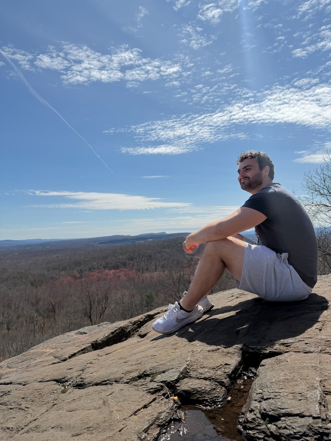 Casper on a hike at a rocky overlook